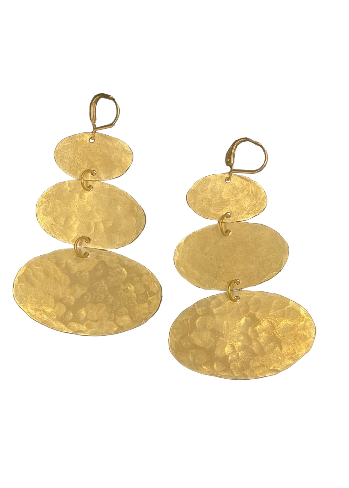 A pair of gold drop earrings made of stacked hammered oval discs of varying sizes, suspended from simple gold rings, shown against a plain white background.